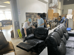 people in ReStore moving couches